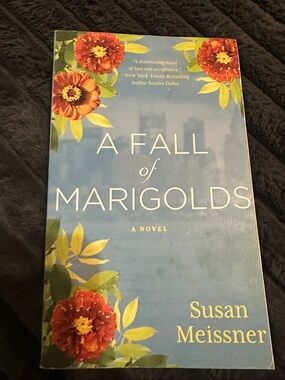 A Fall of Marigolds by Susan Meissner - Blue Floral Paperback